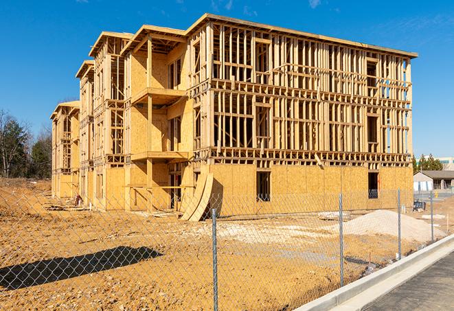 a close-up of temporary chain link fences enclosing a job site, signaling progress in the project's development in Doraville GA